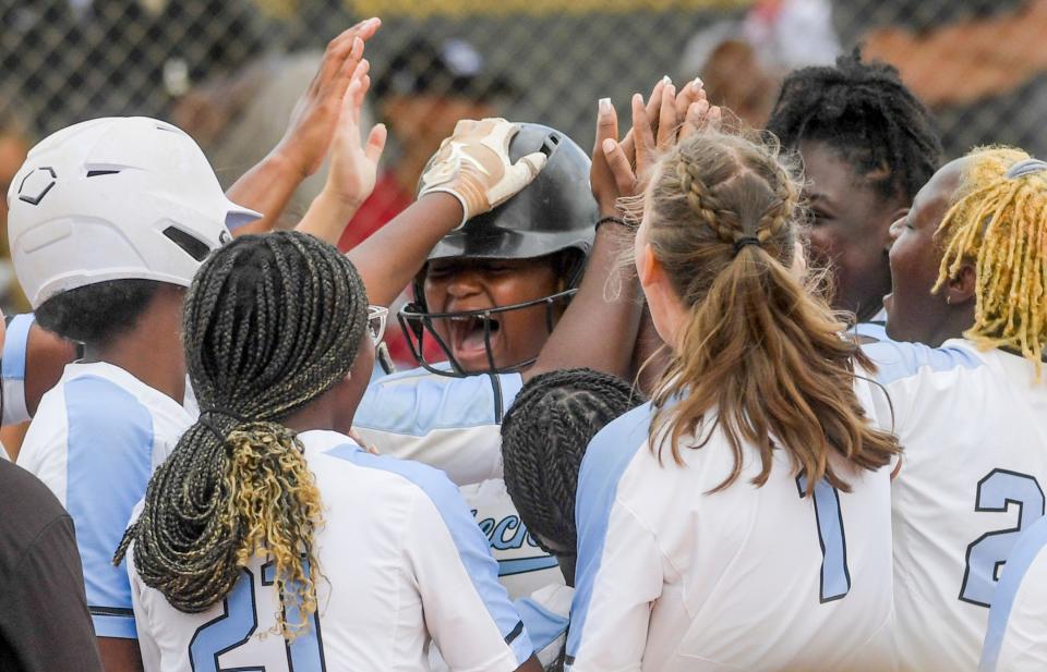 BrewTech’s Khamiyah is swarmed at home plate after hitting a home run against Elmore County in the AHSAA Softball Championships at Choccolocca Park in Oxford, Ala, on Thursday May 18, 2023.  