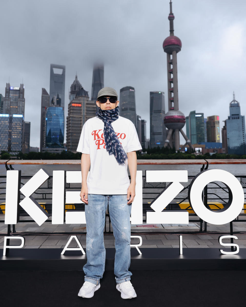 Nigo, Kenzo's artistic director, posed in front of Shanghai's skyline ahead of Kenzo's Shanghai runway show
