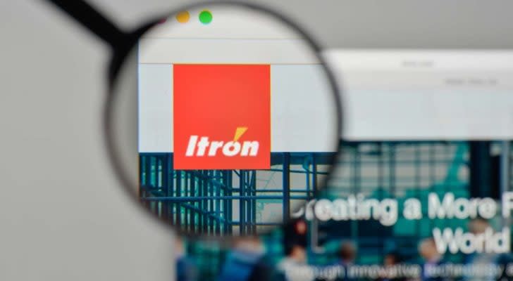 A magnifying glass zooms in on the Itron, Inc. (ITRI) logo