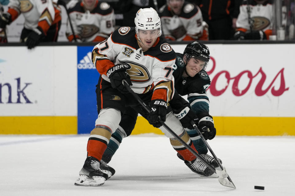 San Jose Sharks left wing William Eklund, right, knocks the puck away from Anaheim Ducks right wing Frank Vatrano during the first period of an NHL hockey game Thursday, Feb. 29, 2024, in San Jose, Calif. (AP Photo/Godofredo A. Vásquez)
