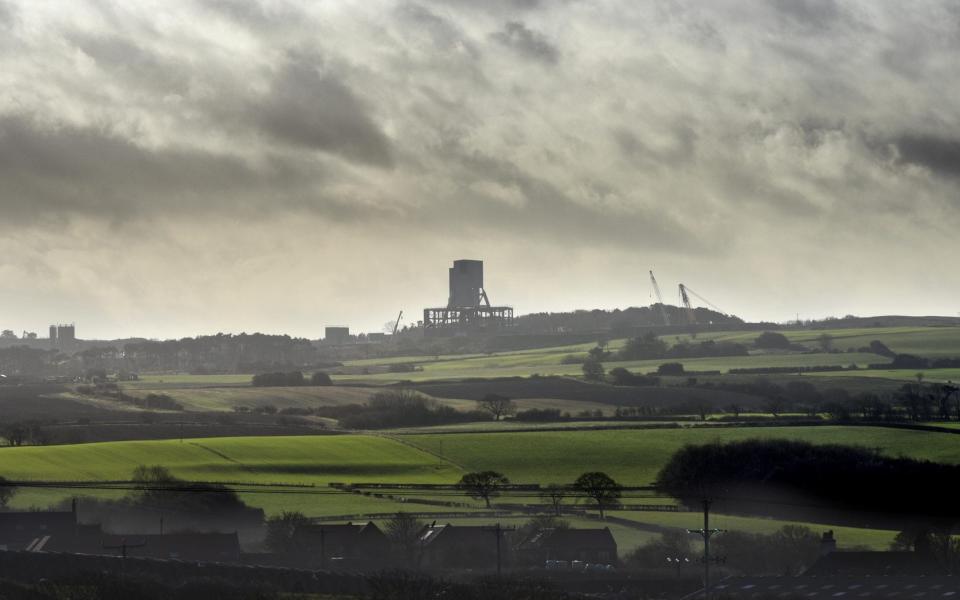 A structure on Sirius Minerals' Woodsmith polyhalite mine site rises above farmland at Sneatonthorpe, near Whitb - Asadour Guzelian