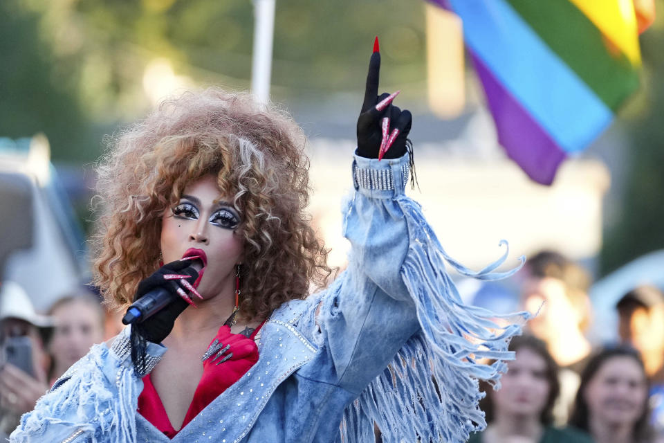 FILE - Lilia performs a Cyndi Lauper song during the RaYnbow Collective hosting a Back to School Pride Night for BYU students at Kiwanis Park in Provo, Utah, on Sept. 3, 2022. A federal judge has granted the request Friday, June 17, 2023, of an Utah-based group that organizes drag performances for a preliminary injunction, directing the city of St. George to issue a permit for the group to host an all-ages drag show in a public park and calling the attempt of city officials to stop the show unconstitutional. (Francisco Kjolseth/The Salt Lake Tribune via AP, File)
