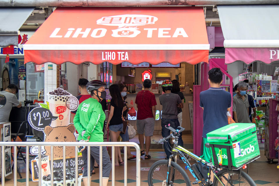 People seen queuing at a bubble tea shop in Clementi on 19 June 2020. (PHOTO: Dhany Osman / Yahoo News Singapore)