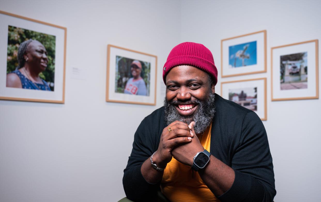 Photographer Reginald Cunningham of Washington, D.C., poses for a portrait with his photography series "Black Pearls" at the Boca Raton Museum of Art.
