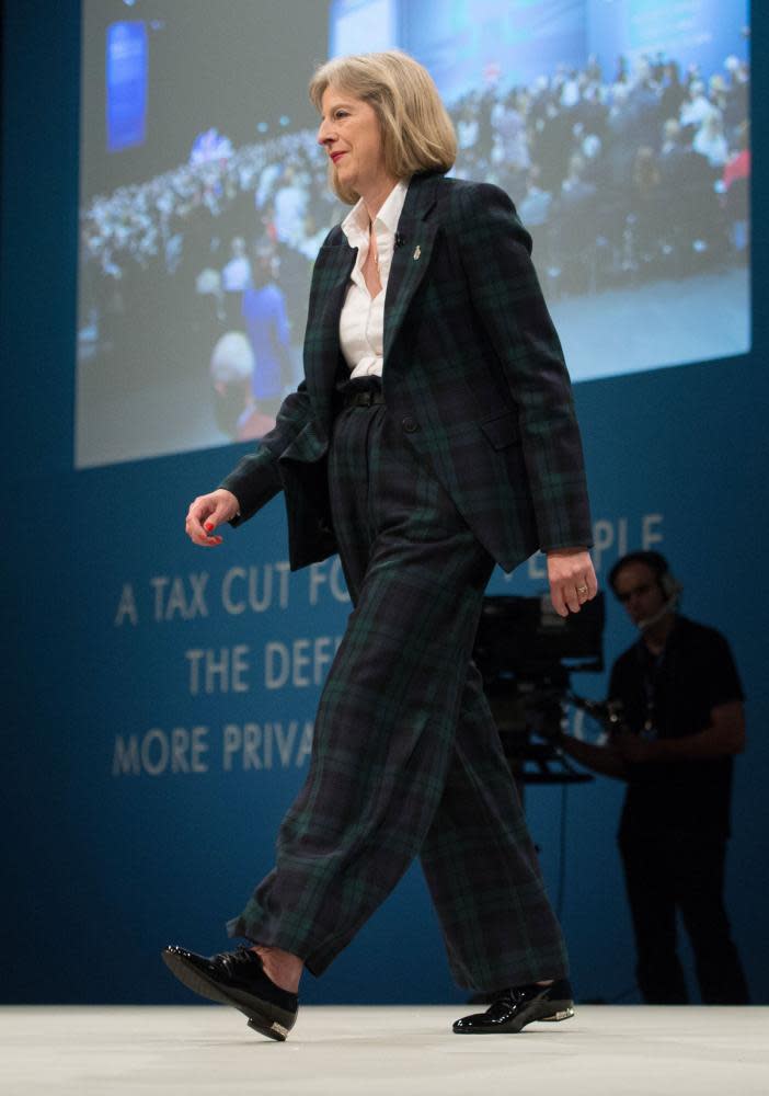 May addresses the Conservative party conference in Manchester in a tartan suit.