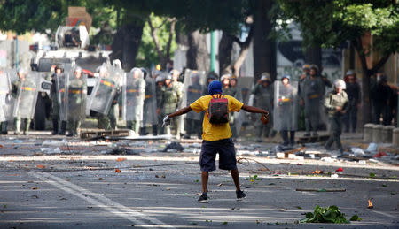 A demonstrator gestures while clashing with riot security force at a rally during a strike called to protest against Venezuelan President Nicolas Maduro's government in Caracas, Venezuela July 26, 2017. REUTERS/Carlos Garcia Rawlins