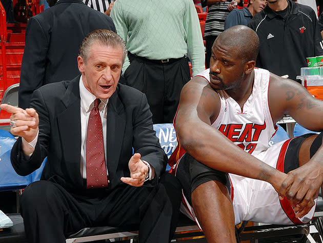 Pat Riley and Shaq discuss the Jamal Mashburn-for-Sasha Danilovic deal. (Getty Images)