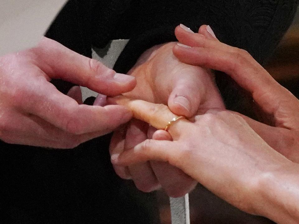 Prince Harry places the wedding ring on the finger of Meghan Markle during their wedding service, conducted by the Archbishop of Canterbury Justin Welby in St George's Chapel at Windsor Castle on May 19, 2018 in Windsor, England