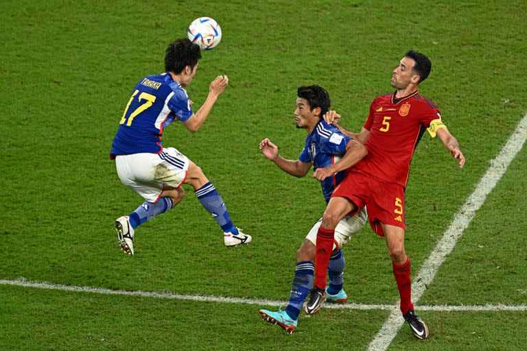 Spain's forward #17 Yeremy Pino (L) heads the ball during the Qatar 2022 World Cup Group E football match between Japan and Spain at the Khalifa International Stadium in Doha on December 1, 2022. (Photo by Jewel SAMAD / AFP)