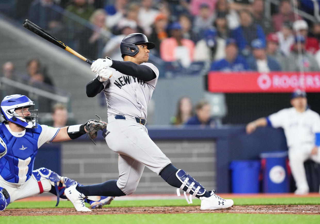 Apr 17, 2024; Toronto, Ontario, CAN; New York Yankees right fielder Juan Soto (22) hits an RBI double against the Toronto Blue Jays during the fifth inning at Rogers Centre.