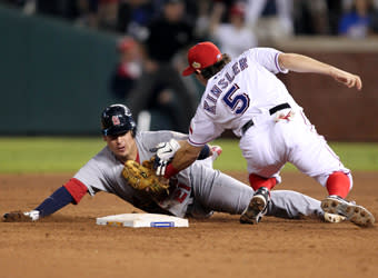 Texas second baseman Ian Kinsler tags out Allen Craig at second base to complete a double play in the ninth inning of Game 5