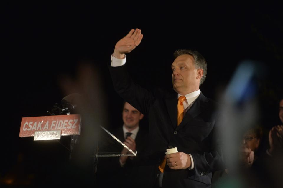 Hungarian Prime Minister Viktor Orban, leader of the ruling centre-right Fidesz party waves to supporters prior to his victory speech after the parliamentary elections, in Budapest, Hungary, late Sunday, April 6, 2014. (AP Photo/MTI, Szilard Koszticsak)