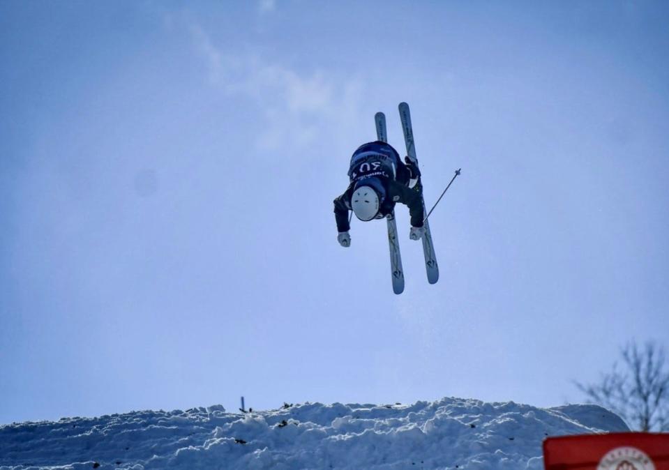 Eden Kruger performs an aerial stunt during her mogul ski run at the U.S. Freestyle Junior Nationals in Steamboat, Colorado.
