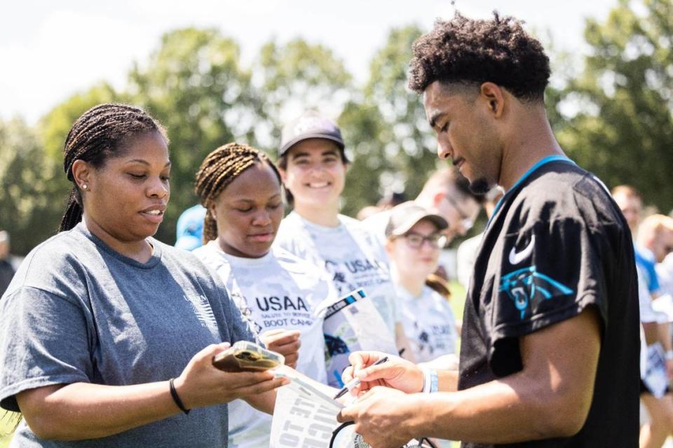 Carolina Panthers Bryce Young signs autographs during USAA’s Salute to Service NFL Boot Camp in Charlotte, N.C., on Monday, August 14, 2023.