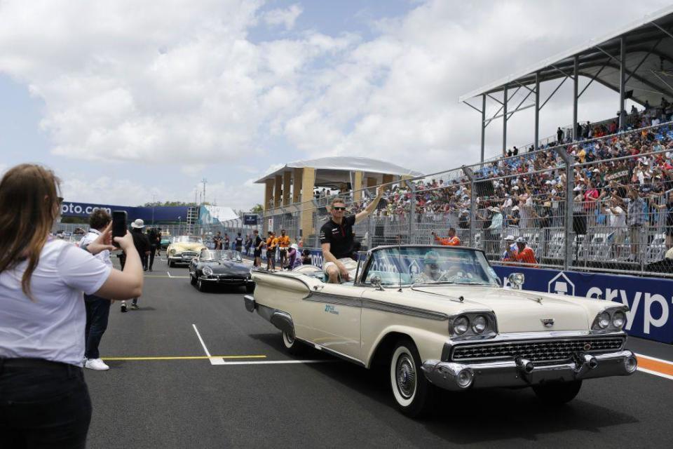 Haas driver Nico Hulkenberg sits in an open-top car during the drivers' parade before the 2023 Miami Grand Prix