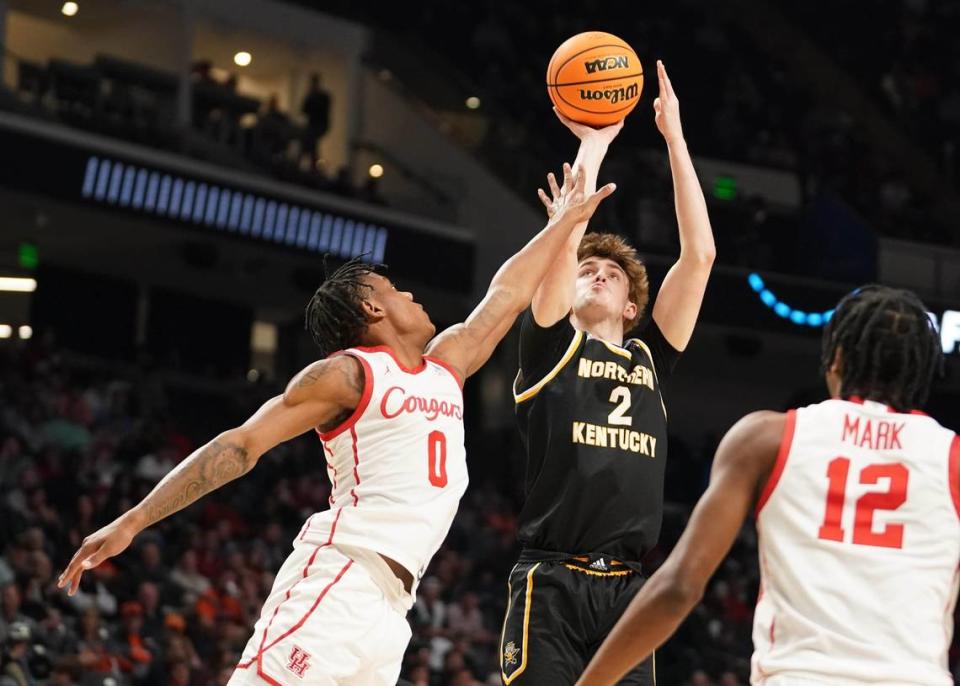 Northern Kentucky’s Sam Vinson (2) shoots over Houston’s Marcus Sasser (0) during the first half. Vinson led NKU with 15 points Thursday night.