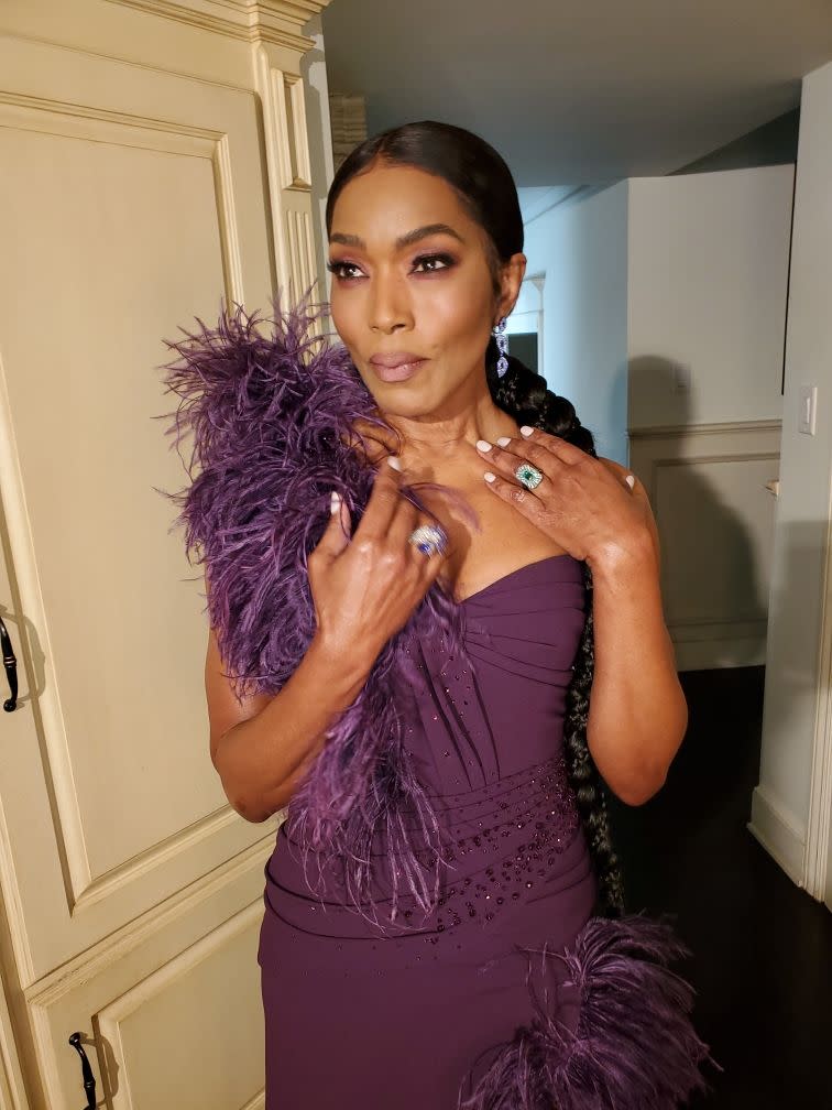 <p>Bassett complemented her feathery Dolce & Gabbana gown with sapphire and diamond earrings, plus a peacock-blue indicolite and titanium ring by Brazilian jewellery designer, <a href="https://grazielagems.com" rel="nofollow noopener" target="_blank" data-ylk="slk:Graziela Kaufman;elm:context_link;itc:0;sec:content-canvas" class="link ">Graziela Kaufman</a>. </p>
