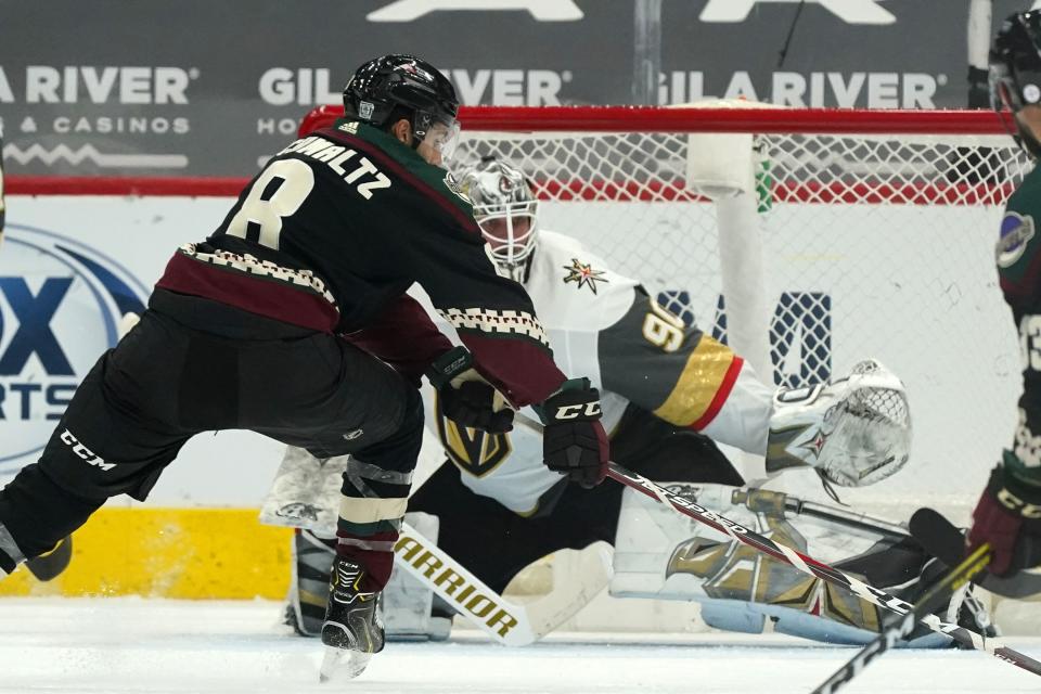 Arizona Coyotes center Nick Schmaltz (8) beats Vegas Golden Knights goaltender Robin Lehner (90) for a goal during the second period of an NHL hockey game Friday, Jan. 22, 2021, in Glendale, Ariz. (AP Photo/Ross D. Franklin)