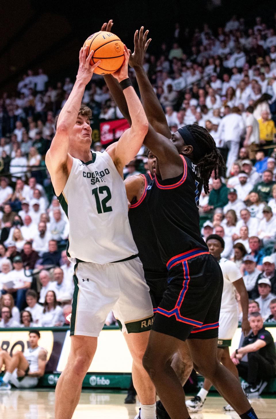 CSU senior forward Patrick Cartier (12) goes up for a tough basket against Boise State at Moby Arena on Tuesday, Feb. 6, 2024.