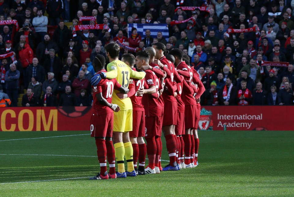 Liverpool players observe a minute’s silence to mark the centenary of Armistice Day