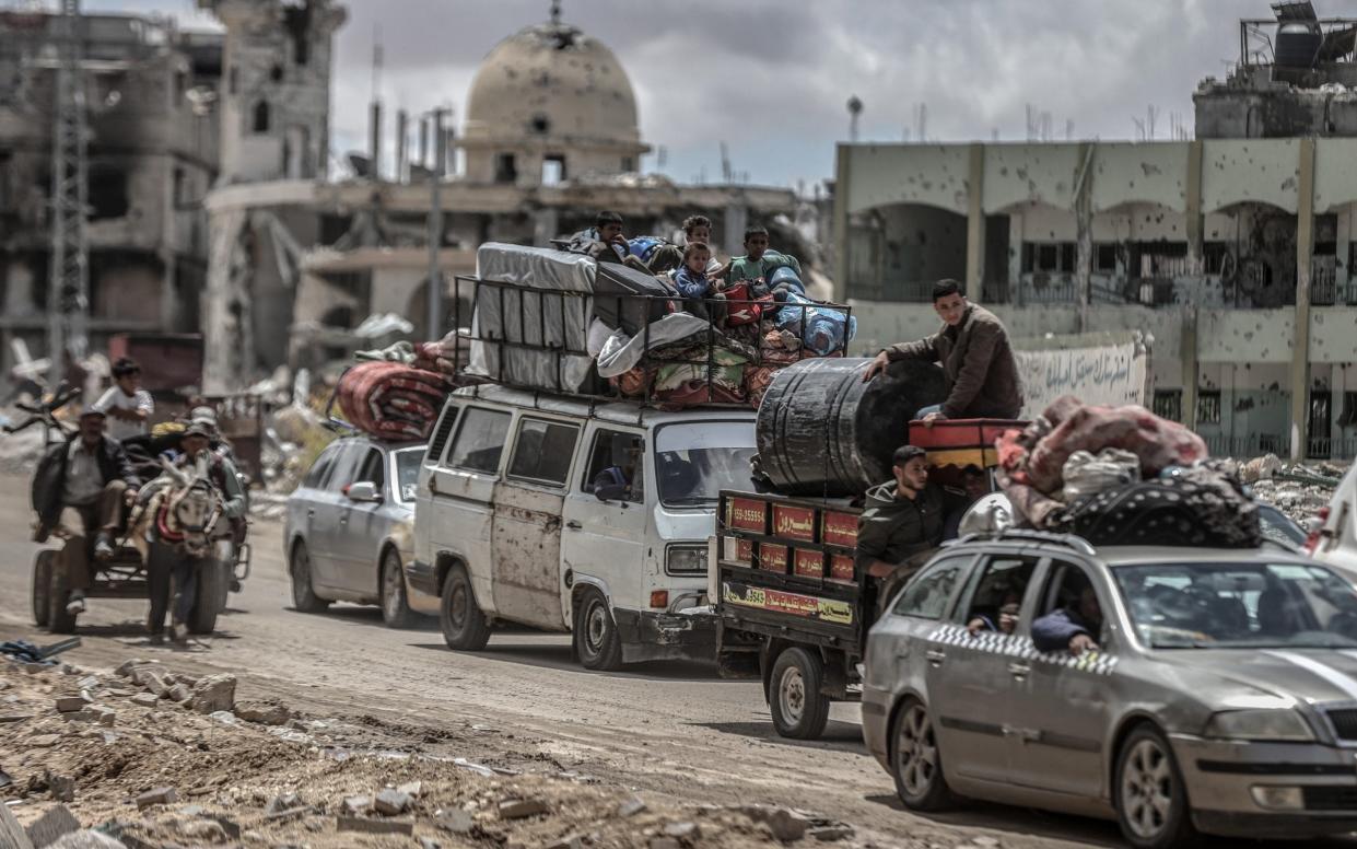 Palestinians begin to leave areas of Rafah after Israel issued a warning to evacuate