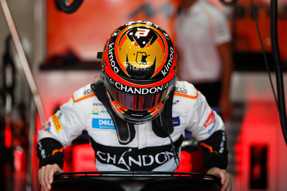 Load it up: Stoffel Vandoorne slides into his McLaren as Friday practice gets under way at Hockenheim