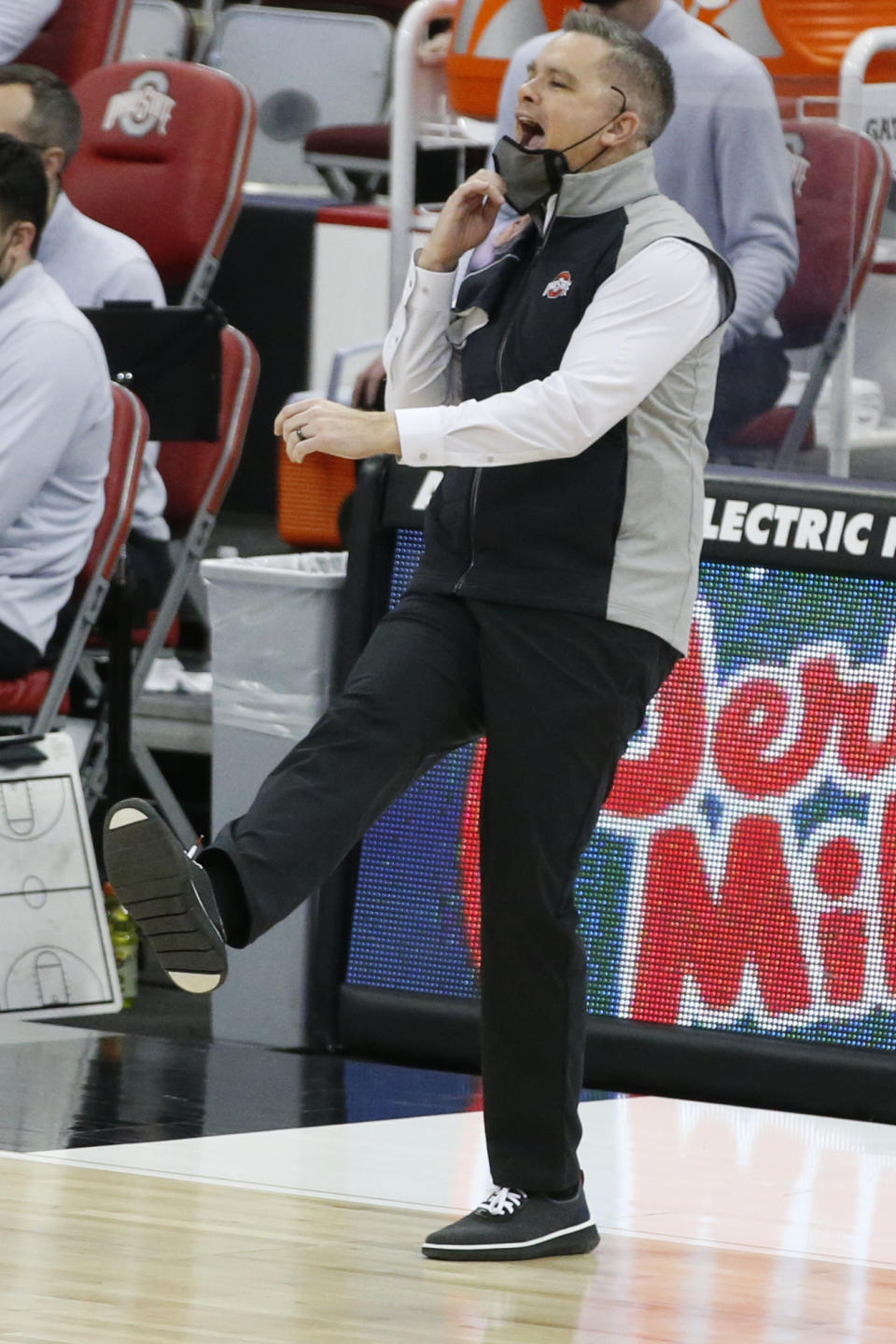 Ohio State head coach Chris Holtmann reacts to his team's play against Michigan during the first half of an NCAA college basketball game Sunday, Feb. 21, 2021, in Columbus, Ohio. (AP Photo/Jay LaPrete)