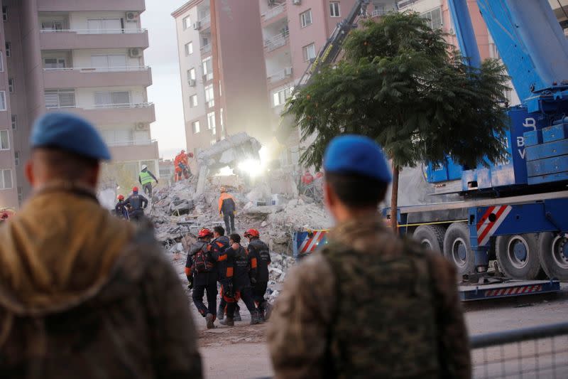 Rescue operations take place on a site after an earthquake struck the Aegean Sea, in the coastal province of Izmir