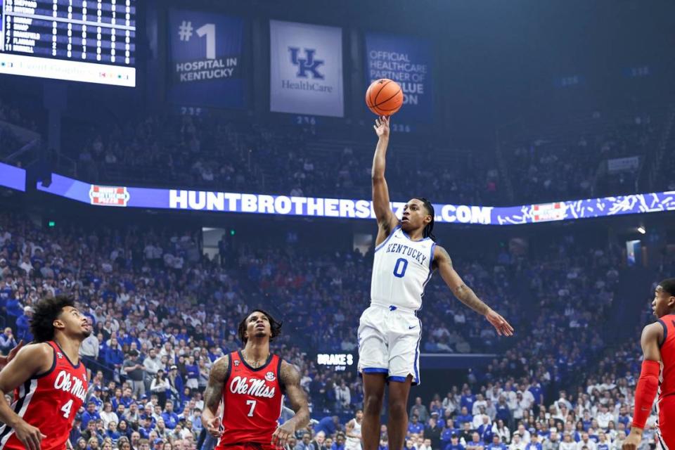 Kentucky Wildcats guard Rob Dillingham (0) shoots the ball against Mississippi Rebels guard Allen Flanigan (7) during the game at Rupp Arena in Lexington Tuesday, February 13, 2024. Silas Walker/swalker@herald-leader.com