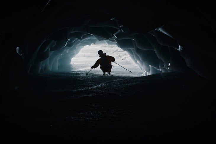 Markus Eder skis through a glacier cave in The Ultimate Run