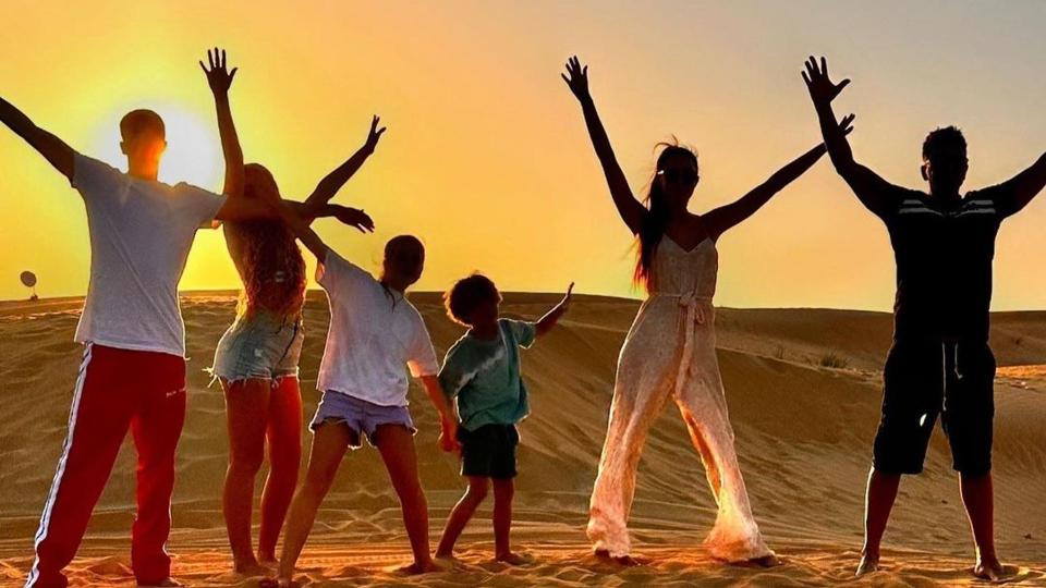 Peter and Emily Andre with children on desert holiday