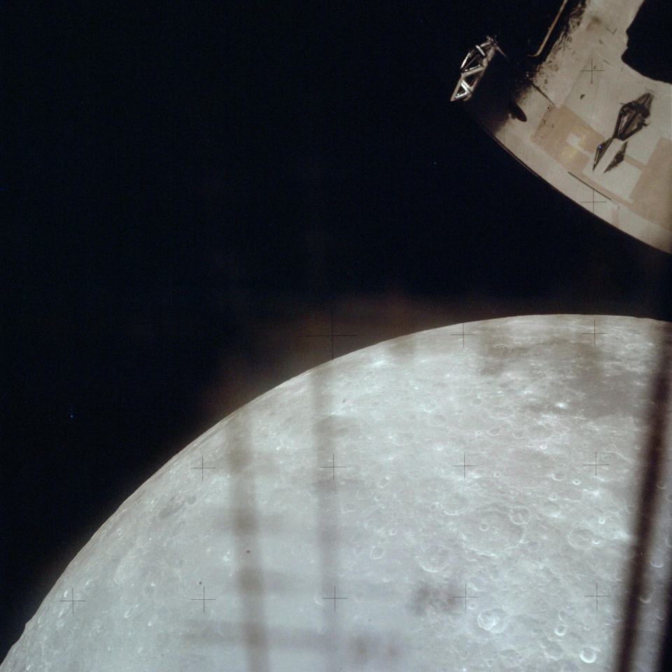 This April 1970 photo made available by NASA shows the moon through a window on the lunar module as the Apollo 13 crew heads back towards the Earth. (NASA via AP)