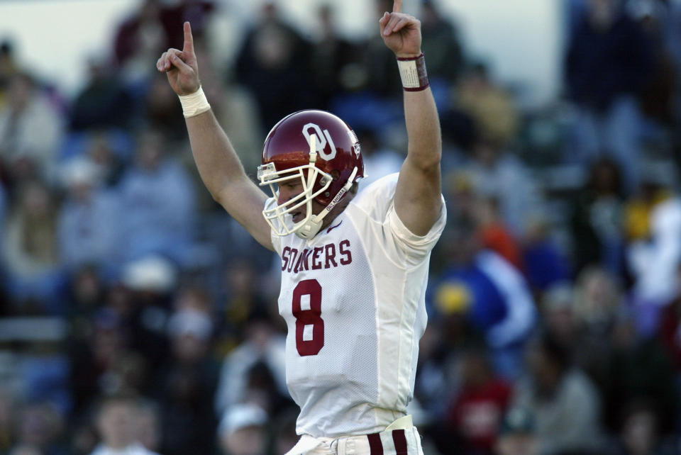 Quarterback Nate Hybl #8 of the University of Oklahoma Sooners celebrates a touchdown against the Baylor University Bears during the game at Floyd Casey Stadium on Nov. 16, 2002 in Waco, Texas. Oklahoma won 49-9. Ronald Martinez/Getty Images