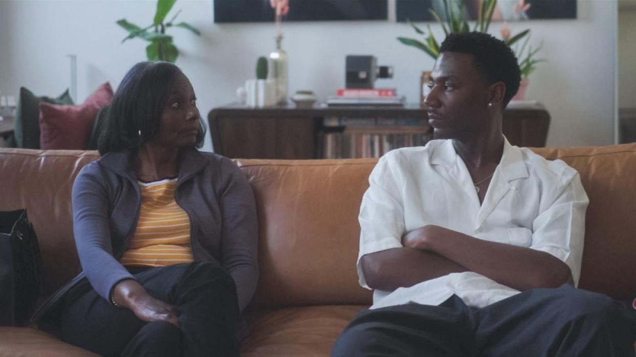 a man and a woman sitting on a couch