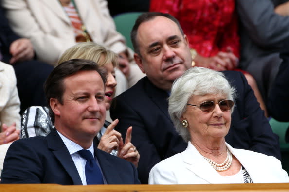 British Prime Minister David Cameron, his mother Mary Cameron and First Minister of Scotland Alex Salmond (Back) sit in the Royal Box during the Gentlemen's Singles final match between Roger Federer of Switzerland and Andy Murray of Great Britain on day thirteen of the Wimbledon Lawn Tennis Championships at the All England Lawn Tennis and Croquet Club on July 8, 2012 in London, England. (Photo by Clive Brunskill/Getty Images)