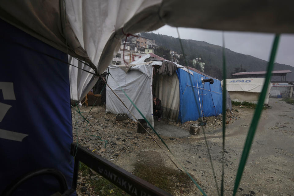 This Friday, Jan. 12, 2024 photo shows a view of tents sheltering families who are too afraid to return to their partially damaged homes in Antakya, southern Turkey. A year after a powerful earthquake struck southern Turkey, many in the region are struggling to rebuild their lives. (AP Photo/Khalil Hamra)