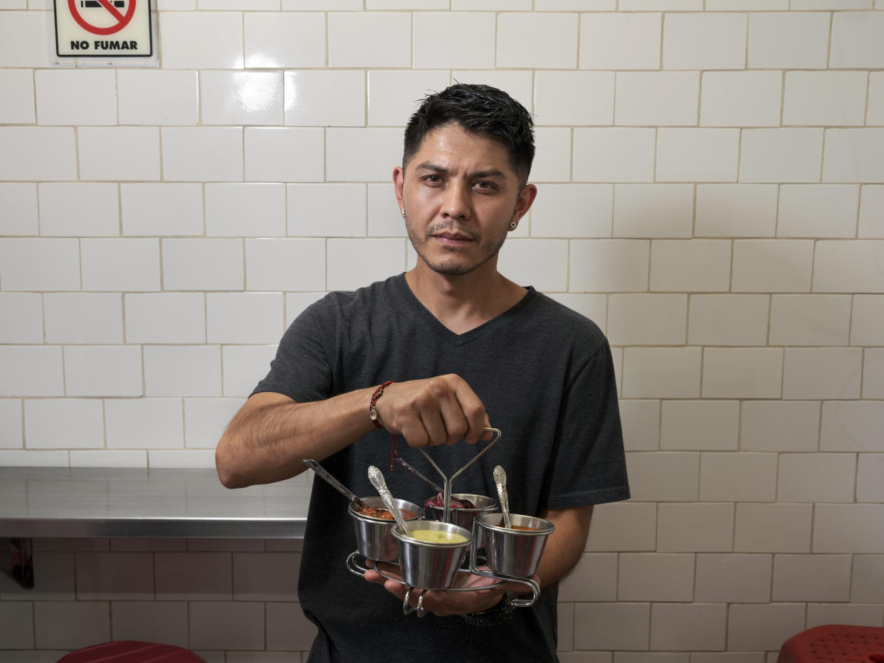 Jorge Campos, the manager of El Compita taquería in the Roma Sur neighborhood of Mexico City, offers some less spicy salsa options. (Luis Antonio Rojas/The New York Times)