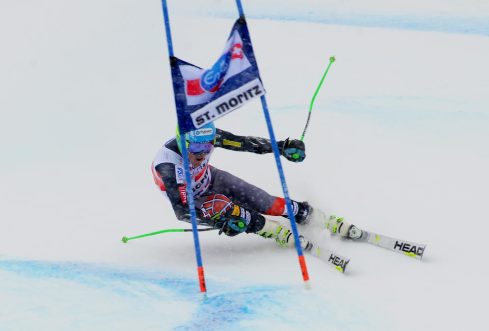 Ted Ligety of the Unites States speeds down the course during the first run of an alpine ski men's World Cup giant slalom in St. Moritz, , Switzerland, Sunday, Feb. 2, 2014. (AP Photo/Pier Marco Tacca)