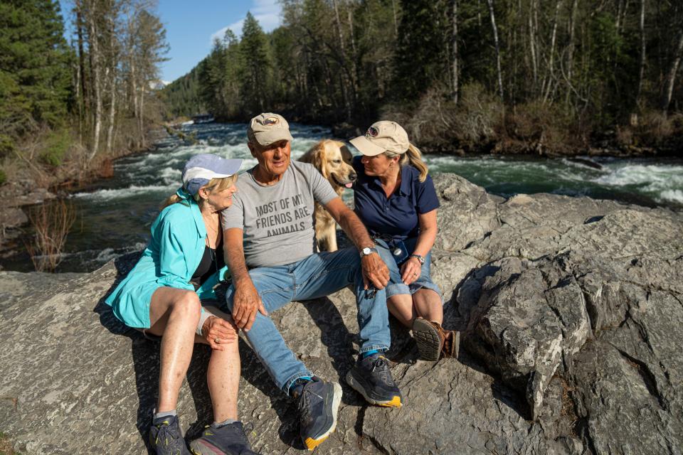 Jack Hanna sits with his wife, Suzi, his service dog, Brassy, and his daughter, Kathaleen, alongside the Swan River as they take their daily walk along the Bigfork Nature Trail near his Montana home on May 2. Aside from his dog, as well as a couple of donkeys and alpaca on their nearby farm, Jack does not have much interaction with animals anymore.