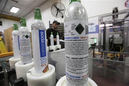 Carbonator bottles are seen at the SodaStream factory in the West Bank Jewish settlement of Maale Adumim January 28, 2014. REUTERS/Ammar Awad