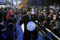 <p>Groundhog Club inner circle member John Grusky wears a thermometer around his neck as he makes the trek to Gobblers Knob for the celebration of the 132nd Groundhog Day in Punxsutawney, Pa. Friday, Feb. 2, 2018. (Photo: Gene J. Puskar/AP) </p>