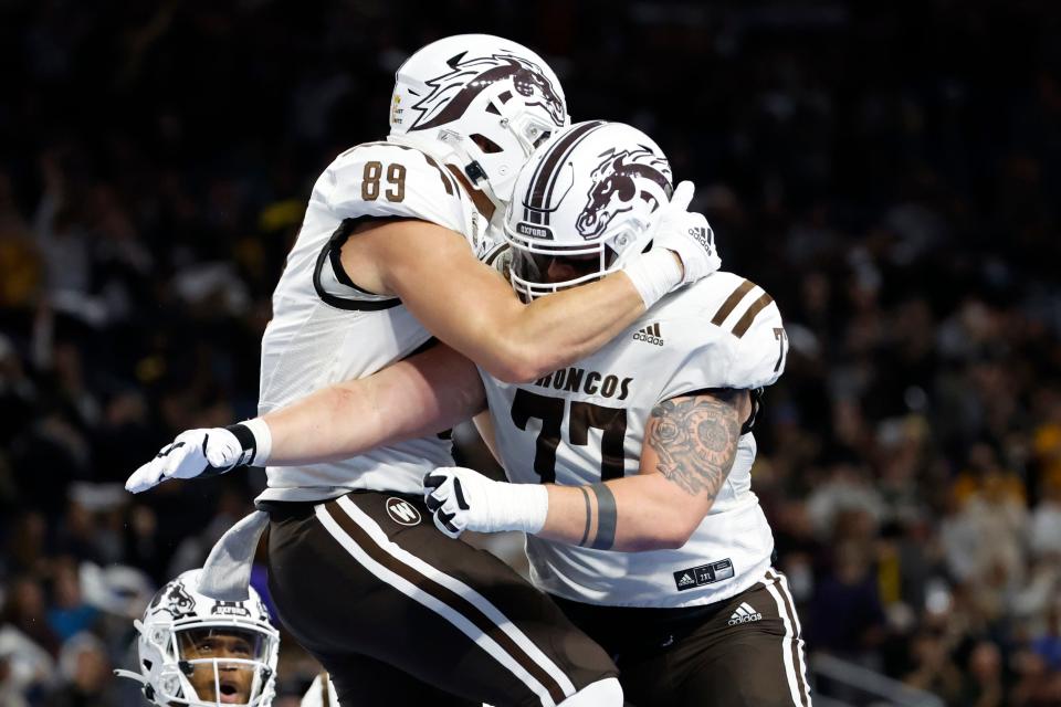 Dec 27, 2021; Detroit, MI, USA; Western Michigan Broncos tight end Brett Borske (89) celebrates with offensive lineman Jacob Gideon (77) after scoring a touchdown in the first half against the Nevada Wolf Pack during the 2021 Quick Lane Bowl at Ford Field.