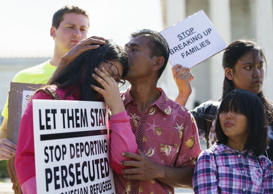 <p>Caitlin Sanger, left, is comforted outside the Supreme Court as Naomi Liem, 10, looks on at right, on Capitol Hill in Washington, Tuesday, June 26, 2018, as they protest immigrant families being split up. Both of their parents are being detained by Ice. Both are from Franklin Park, N.J. (Photo: Carolyn Kaster/AP) </p>