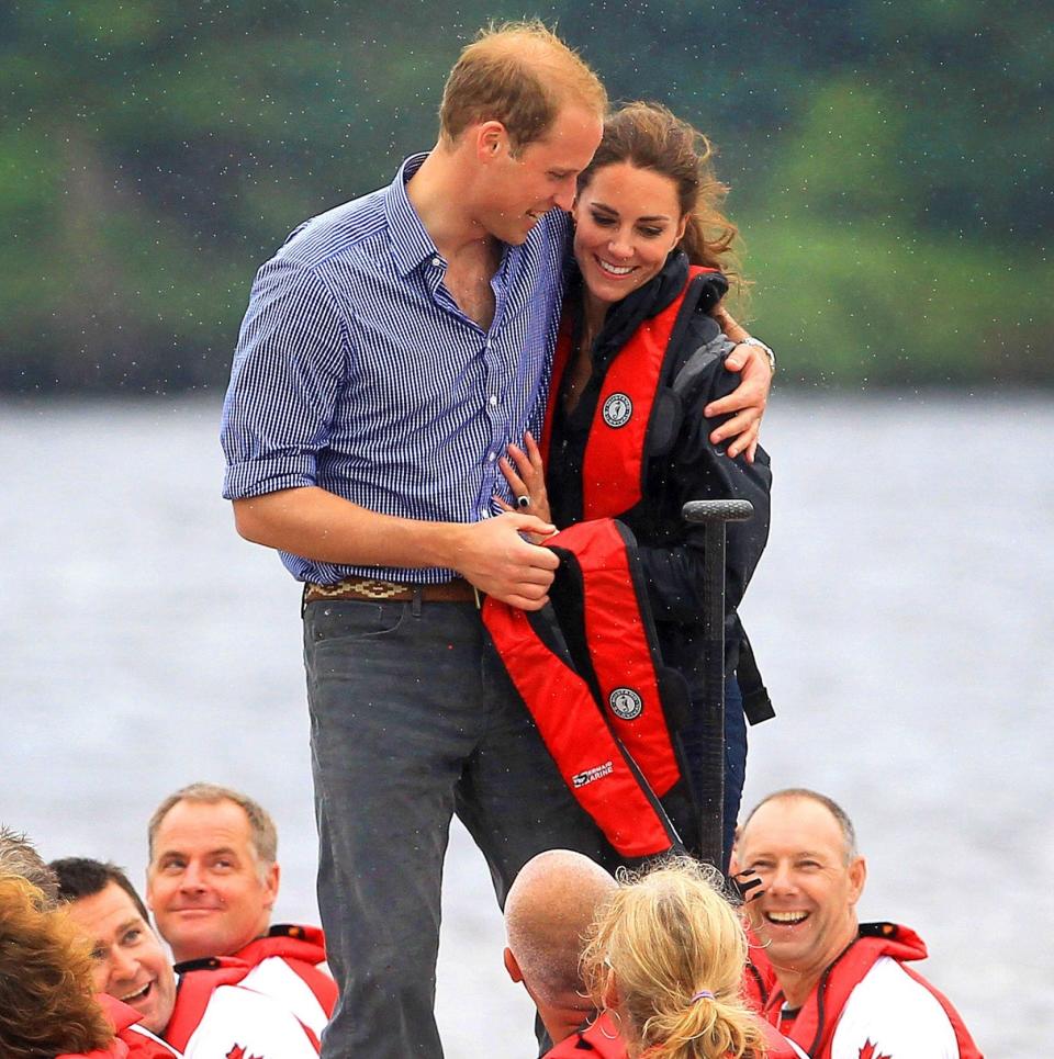 Prince William and Kate Middleton hug after a dragon boat race, once the small matter of competing against one another is over - Macpherson/Gillis/Splash News