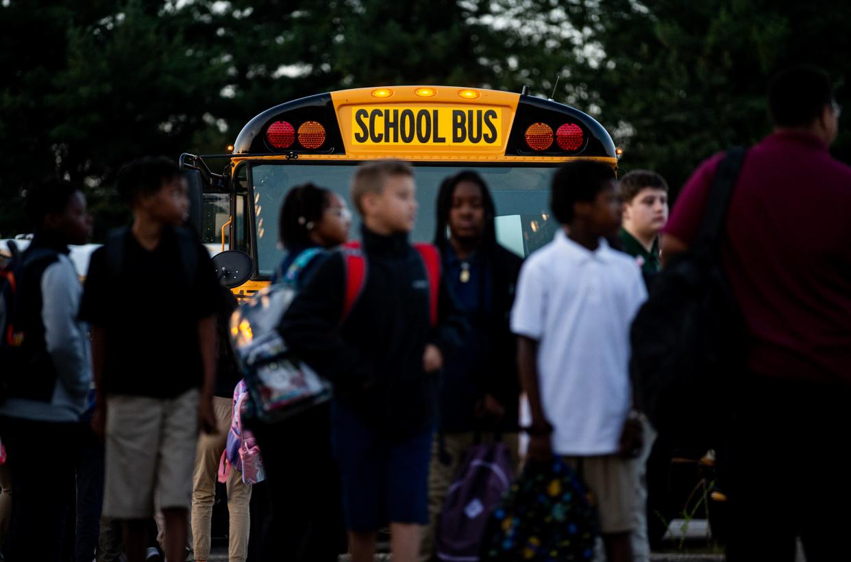 Jefferson County Public School students transfer buses at the Detrick & Nichols Bus Compound on Friday, August 18, 2023.