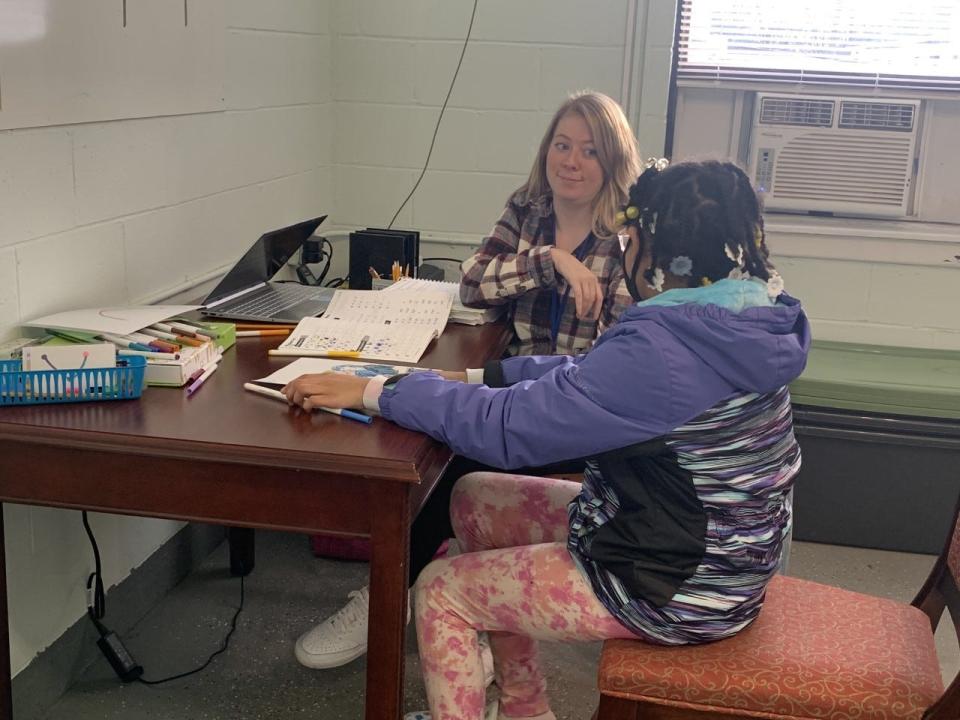 Decode Project literacy mentor Abby Vansickle works with Makenzie Burch, a fourth grader. Vansickle has been with the organization since February.