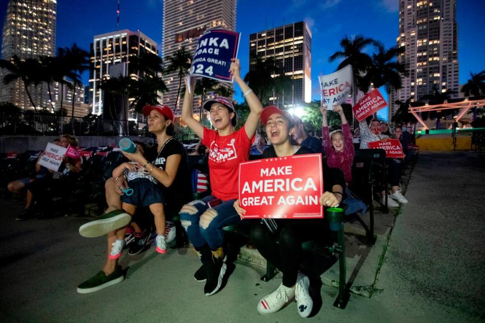 Harel Twito and sister Dvir Twito, left to right, cheer TIvanka Trump as she delivers speech the band shell at Bayfront Park in Miami on Tuesday, October 27, 2020.