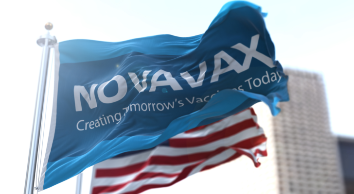 Flag with the Novavax (NVAX) logo waving in the wind with the American flag in the background