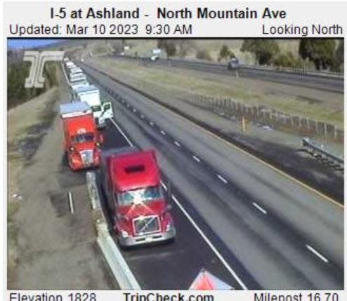 Trucks pulled over on Interstate 5 north near Ashland  on Friday, March 10, 2023, due to a closure of the freeway at the Oregon-California state line.