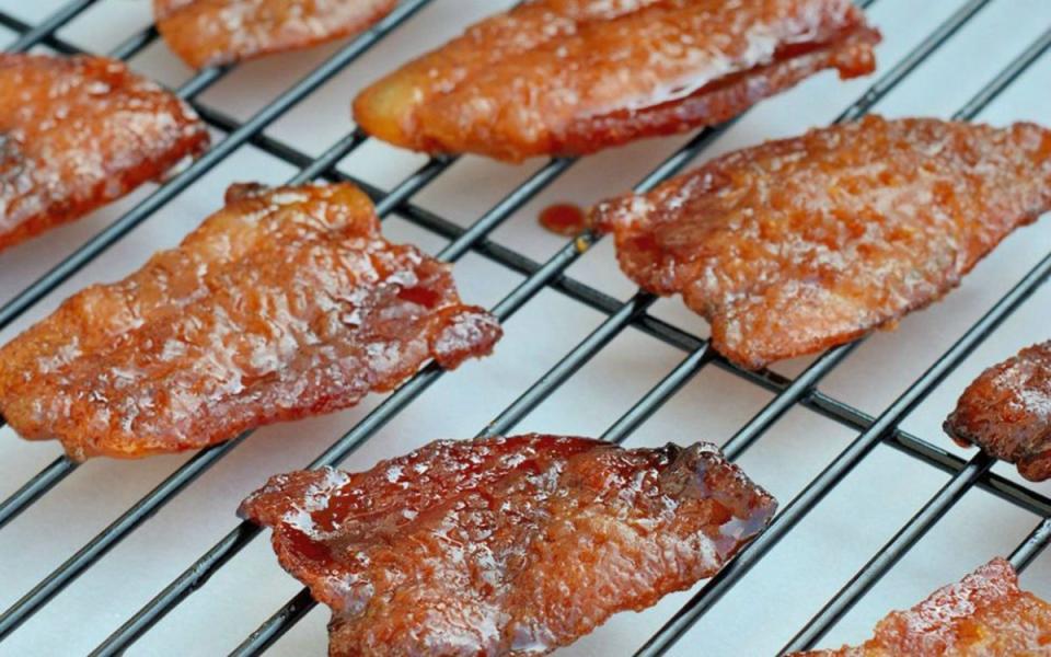 <p>Parade</p><p>Chewy, sweet and salty with a dash of spice from chile and cayenne powder, this will soon be one of your family favorites.</p><p><strong>Get the recipe: <a href="/841483/jessicaformicola/your-new-favorite-snack-candied-bacon/" data-ylk="slk:Candied Bacon;elm:context_link;itc:0;sec:content-canvas" class="link ">Candied Bacon</a></strong></p>